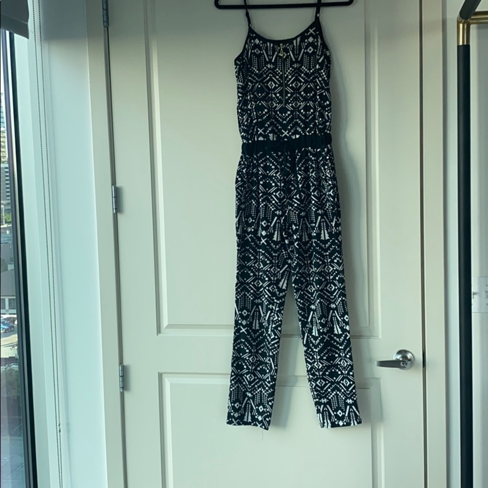 Black and white patterned jumper.